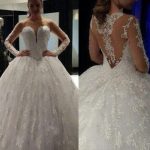 Elegant Ball Gown Lace Wedding Dress with Illusion Bateau Neckline and Long Sleeves