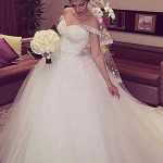 Enchanting Off-Shoulder Ball Gown with Beaded Flowers and Tulle