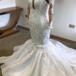 Chic Mermaid Sheer Tulle Wedding Dress with Beaded Appliques and Long Sleeves