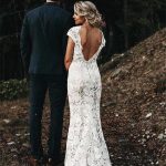 Modern Ivory Beach Wedding Dress with Backless Design and Cap Sleeves