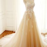 Sweetheart Tulle Champagne Wedding Dress with A-Line Silhouette and Spaghetti Straps