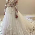 Sheer Neck Ball Gown Wedding Dress with Elegant Beading and Long Sleeves