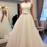Ivory Tulle Wedding Dress with Backless Design and Sleeveless A-Line Silhouette