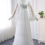 Long Sleeve Lace Tulle Wedding Dress with Empire Waist for a Regal Look