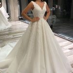 Sophisticated Sleeveless Lace Wedding Dress with V-NeckGlamorous Long A-Line Style