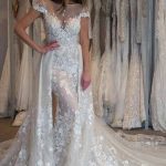 Enchanting Sheer Neck Wedding Dress with Cap Sleeves and a Long Detachable Train for a Gorgeous Style