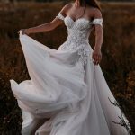 Graceful A-Line Tulle Wedding Dress with Off-the-Shoulder Neckline and Appliques Lace