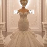 Magnificent Off-the-Shoulder Mermaid Wedding Dresses with Crystal Details and a Backless Design