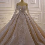 Exquisite Off-the-Shoulder Ball Gown Wedding Dress with Appliques Lace and Long Sleeves