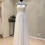 Graceful A-Line Wedding Dresses with High Neckline Chiffon Fabric and Lace Button Details