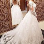 Stunning Long Sleeve A-Line Lace Wedding Dress with Illusion Details and Court Train