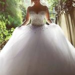 Chic White Tulle Wedding Dress with Illusion Ball Gown Silhouette and Chapel Train