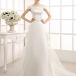 Ruffled Off-the-Shoulder Ivory Wedding Dress with A-Line Silhouette and Sweep Train