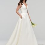 Elegant Satin Bridal Gown with Ivory A-Line Silhouette Pockets and V-Neckline