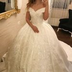 Beautiful V-Neck Tulle Wedding Dress with Spaghetti Straps Beaded Details and Long Ball Gown Silhouette Ivory