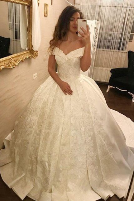 Beautiful V-Neck Tulle Wedding Dress with Spaghetti Straps Beaded Details and Long Ball Gown Silhouette Ivory