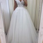 Graceful Off-The-Shoulder Lace Tulle Wedding Dress featuring a Long A-Line Silhouette