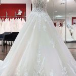 Ball Gown with V-Neckline and Spaghetti Straps featuring Tulle and Lace Details