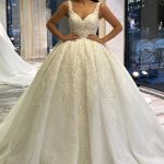 Backless Appliques Lace Sequins Ball Gown Wedding Dress with Sweetheart Neckline Long Sleeves