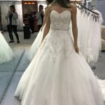 Shinny Beaded Strapless Ball Gown Wedding Dress creating a Precious Look