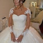 Ivory Lace Appliques Wedding Dress with Sheer Long Sleeves creating a Pretty Look