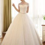 Ball Gown Wedding Dresses with Lace Sequin Bridal Dress in Ivory Color featuring Beading Sash and Backless Style