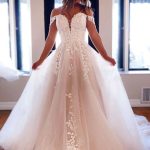 Off Shoulder Chapel Tulle Wedding Dress with Lace and Beading showcasing a Princess Look