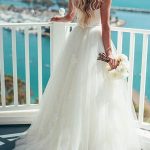 Sweetheart Sleeveless Sweep Tulle Wedding Dress with Sash showcasing a Princess Look