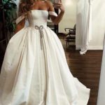 Satin Long Wedding Dress with Pockets showcasing Puffy Off the Shoulder Style