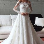 Elegant Long Sleeve Ball Gown Wedding Dress in Off Shoulder Style featuring Sash Detail