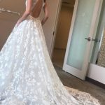Deep V-Neck Lace Beach Wedding Dress with Spaghetti Straps and Sweep Train