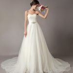 Enchanting Ivory Strapless Lace Beaded Chapel Train Bridal Gown