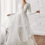 Elegant Ivory A-Line Wedding Gown with Floor-Length Sleeves and V-Neck