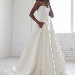 Graceful White A-Line Bridal Gown with Pockets Strapless and Backless