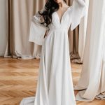 Elegant White Satin Fabric A-Line Bridal Gown with V-Neck Long Sleeves Backless Style and Chains