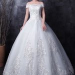 Romantic White Strapless Bridal Gown with Lace Beading and Side Draping