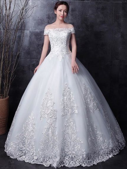 Romantic White Strapless Bridal Gown with Lace Beading and Side Draping